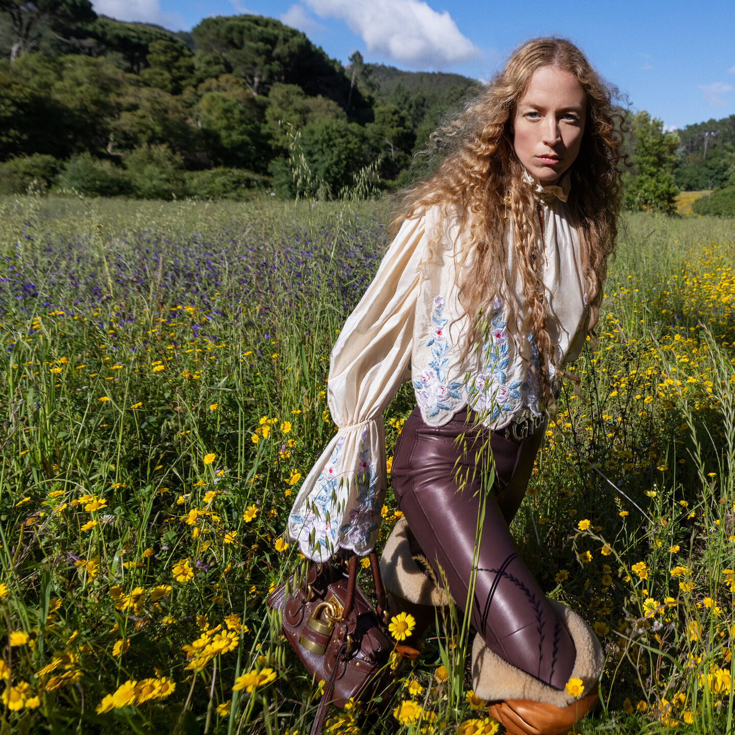 Model Raquel Zimmerman in a green field for Winter 26 campaign